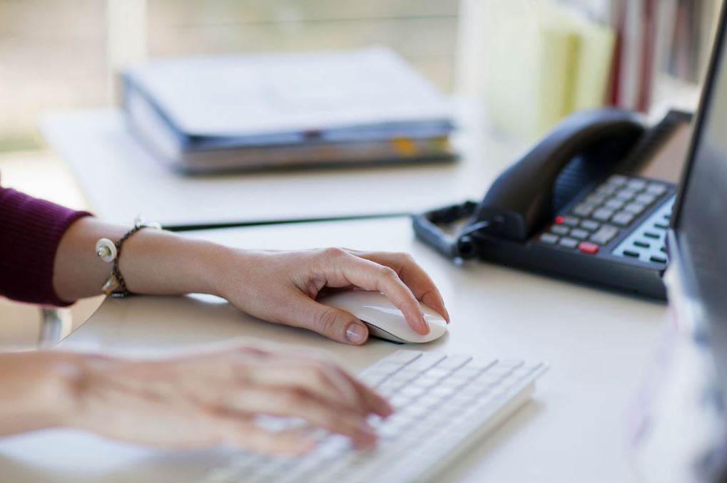 Close up of person on their computer